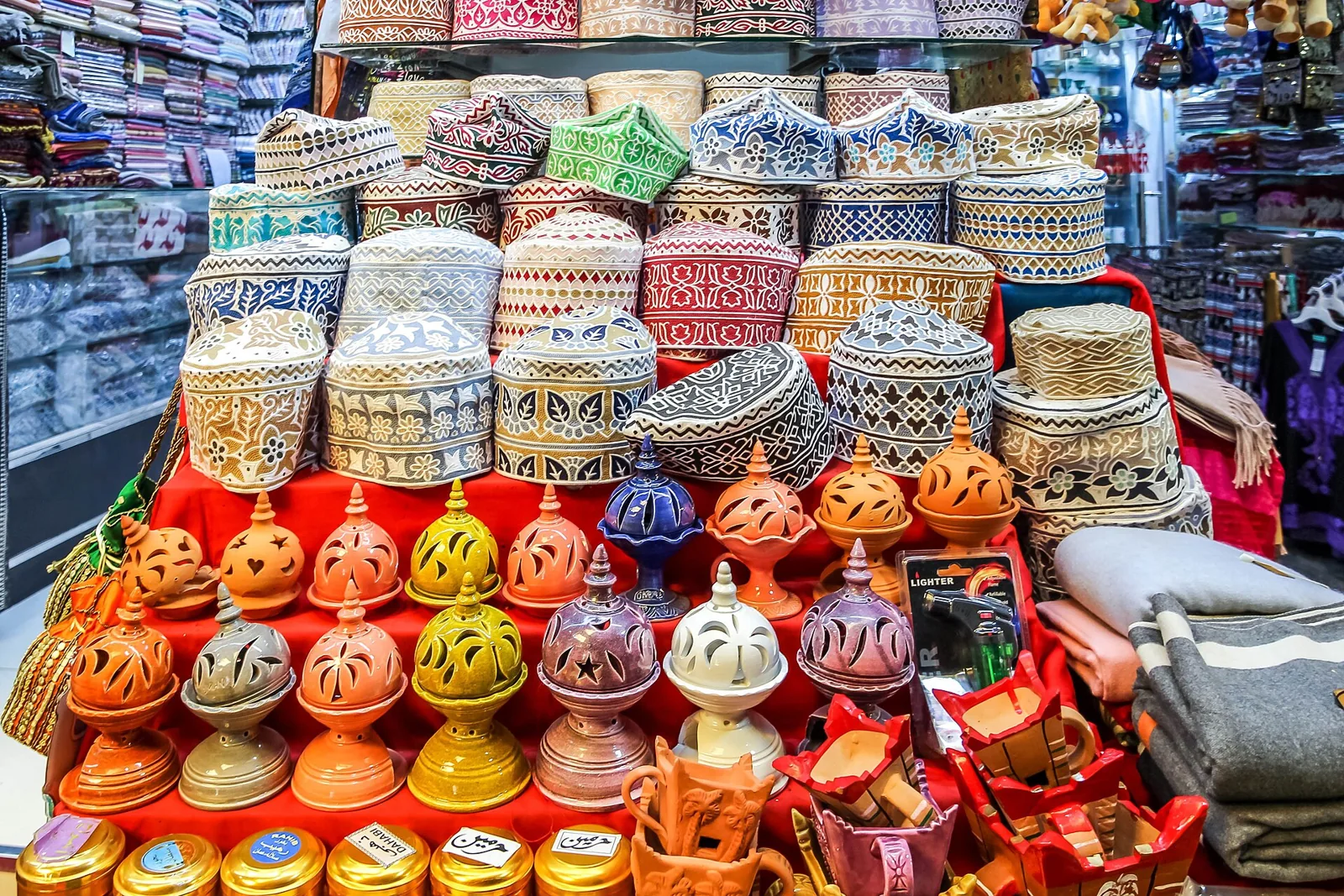 Colourful kuma caps displayed in Mutrah Souq in Oman