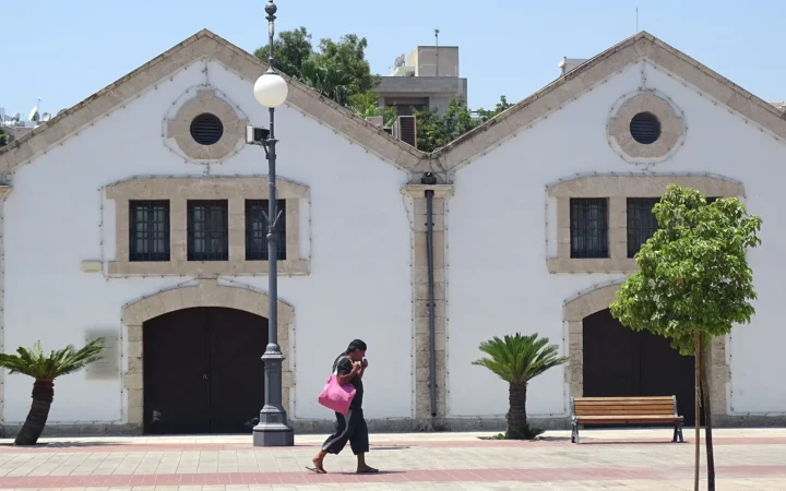 Buildings and pedestrians near Larnaca marina