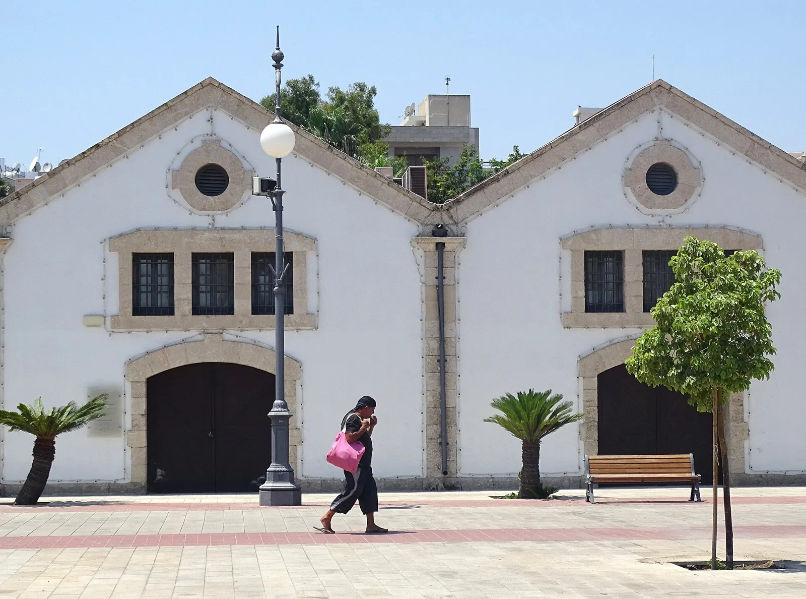 Buildings and pedestrians near Larnaca marina