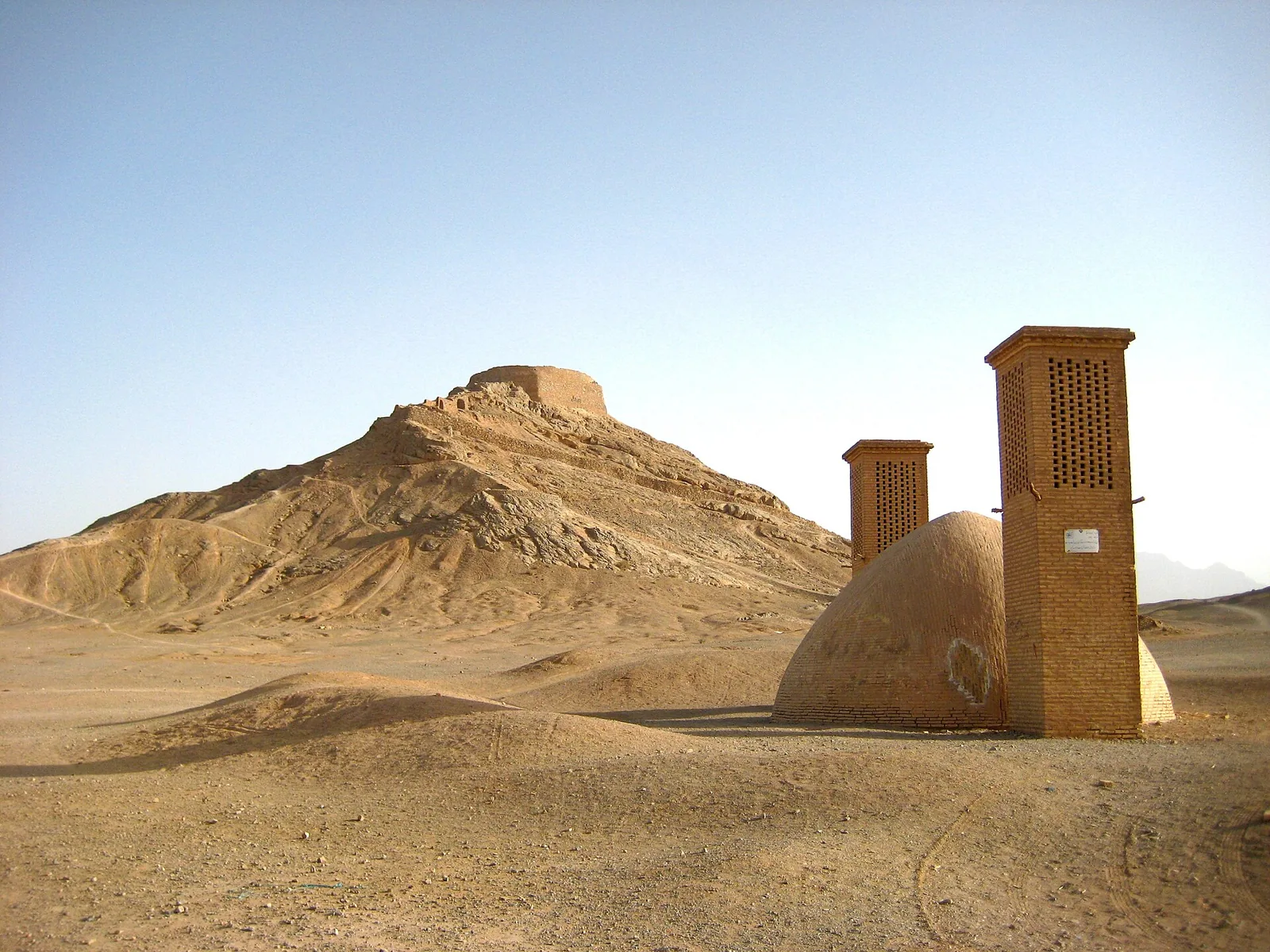 Wind-catcher and domed structure near Yazd’s Towers of Silence