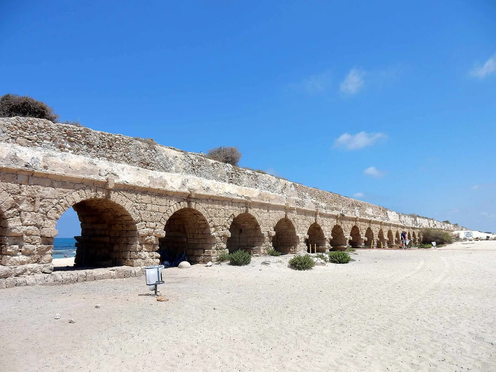 Ancient aqueduct arches beside the beach at Caesarea