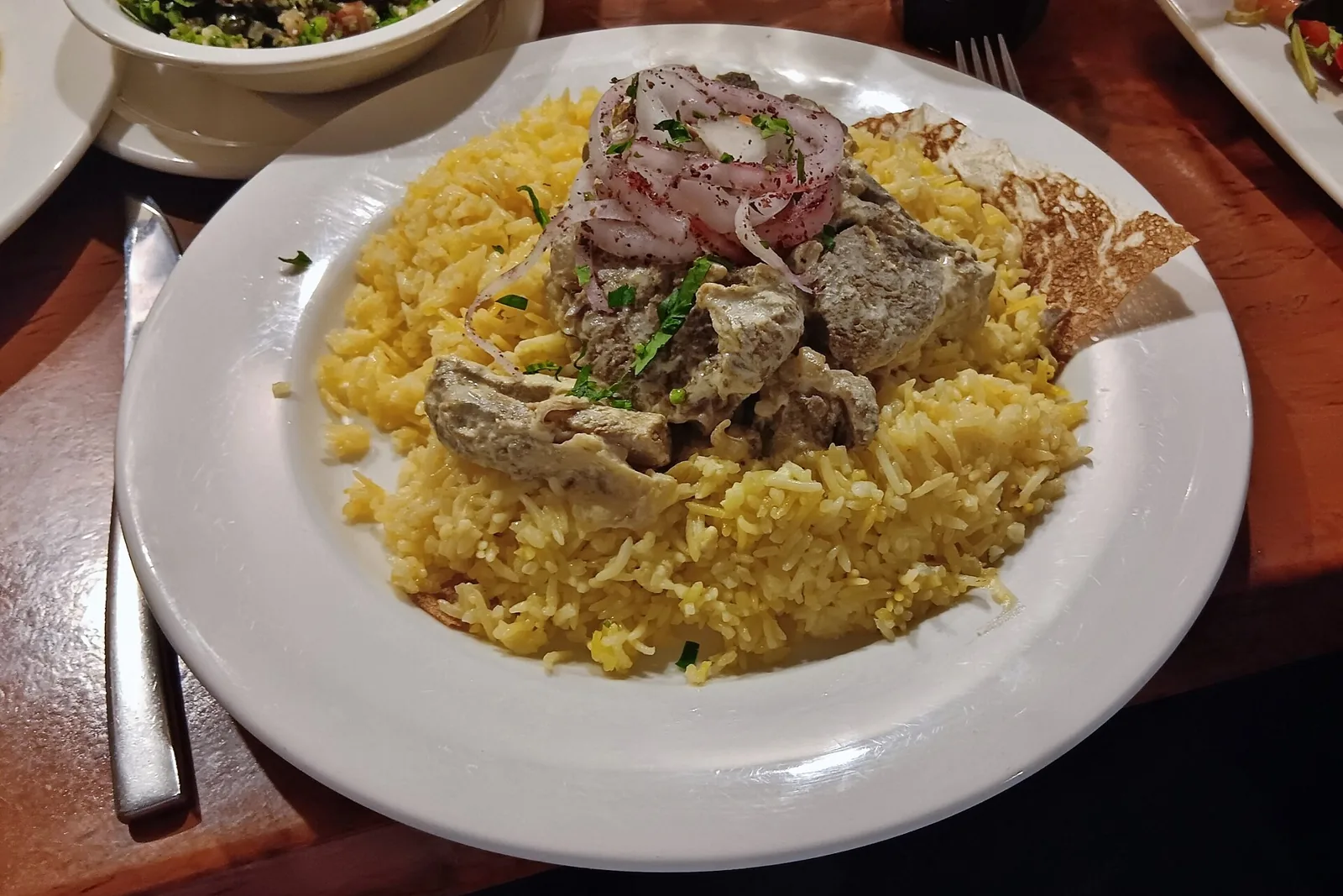 Jordanian mansaf platter served in a restaurant