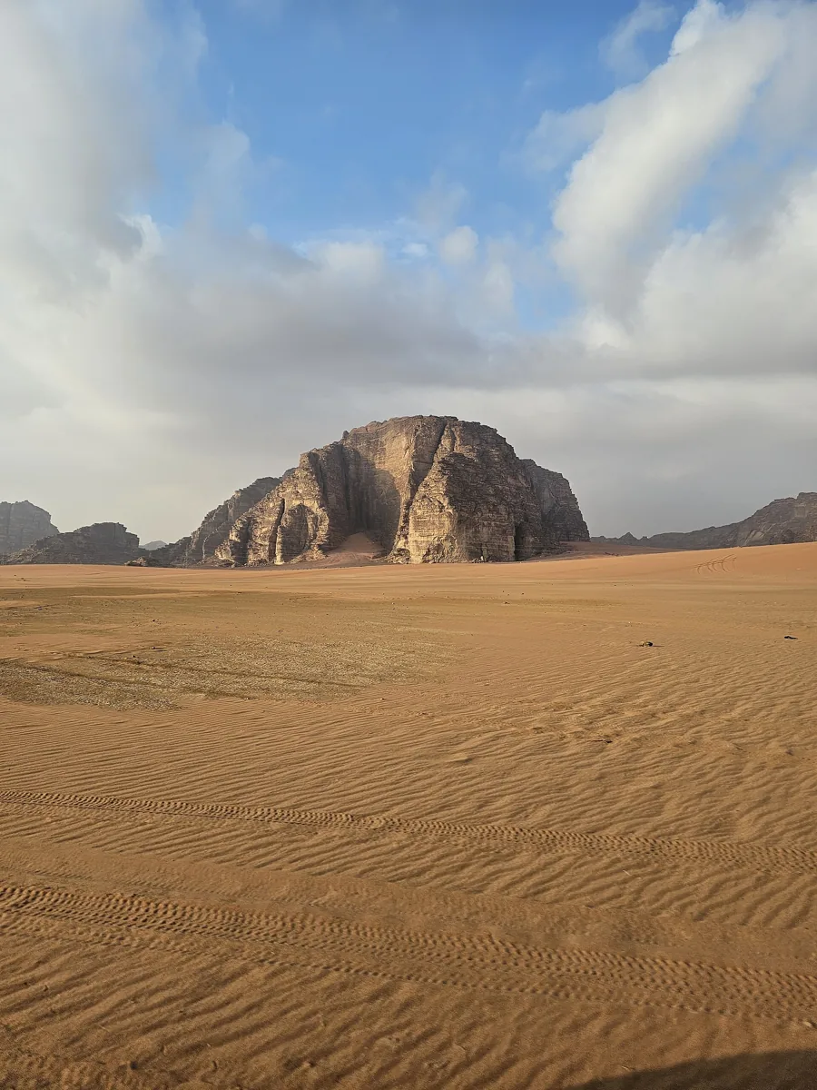 Desert sand and sandstone mountains in Wadi Rum, Jordan
