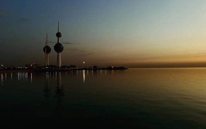 Kuwait Towers beside the water in low evening light
