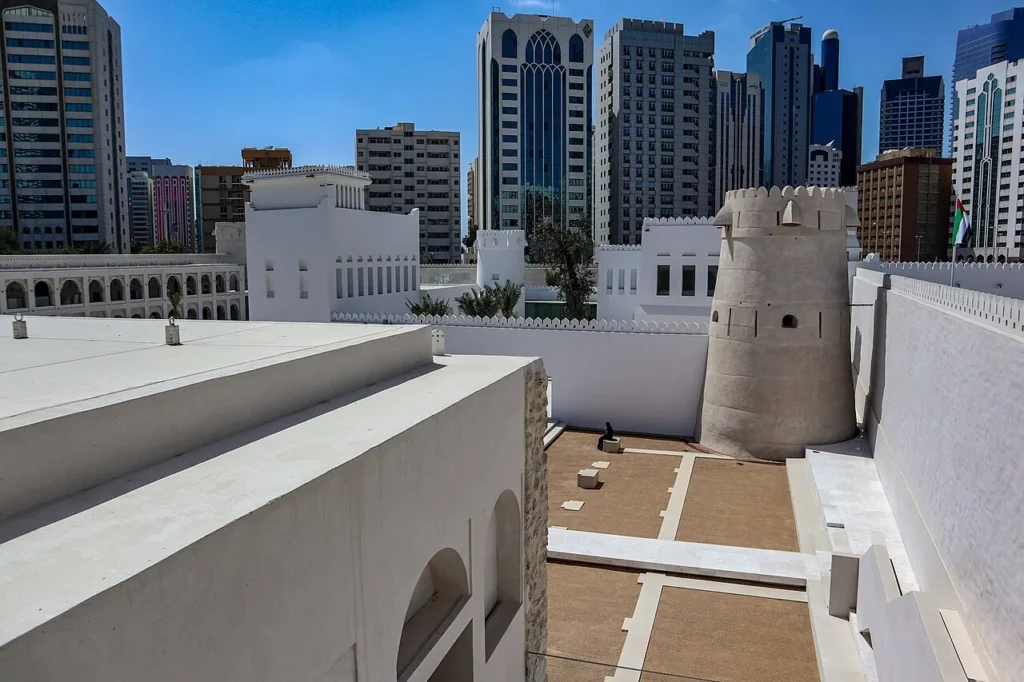 Qasr Al Hosn fort and watchtower with Abu Dhabi buildings behind it